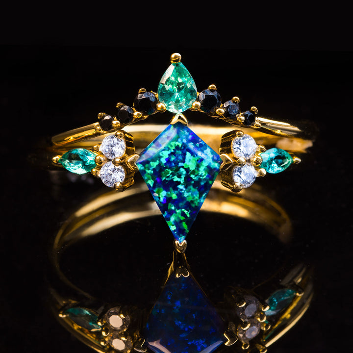 The Life Light ring, kite cut peacock blue opal with diamond details