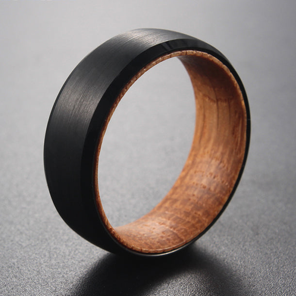 Tungsten carbide ring with whiskey barrel wood inlay