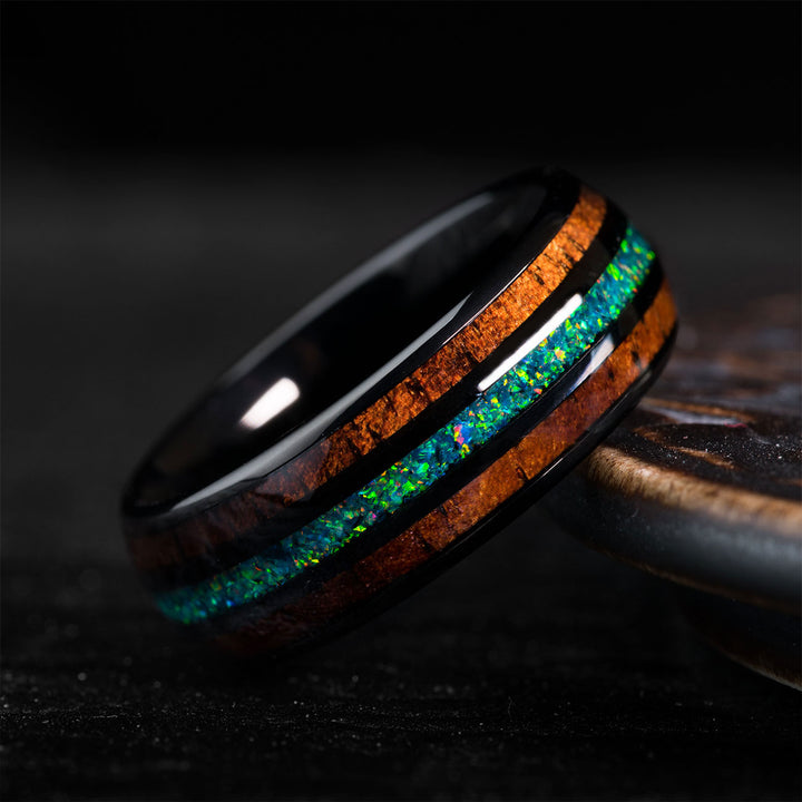 Black tungsten ring with opal and desert ironwood inlay