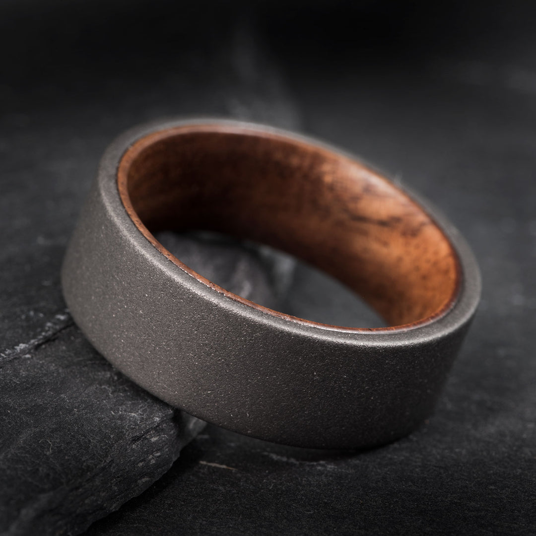 The Savant wedding band: sandblasted tungsten and black walnut inlay
