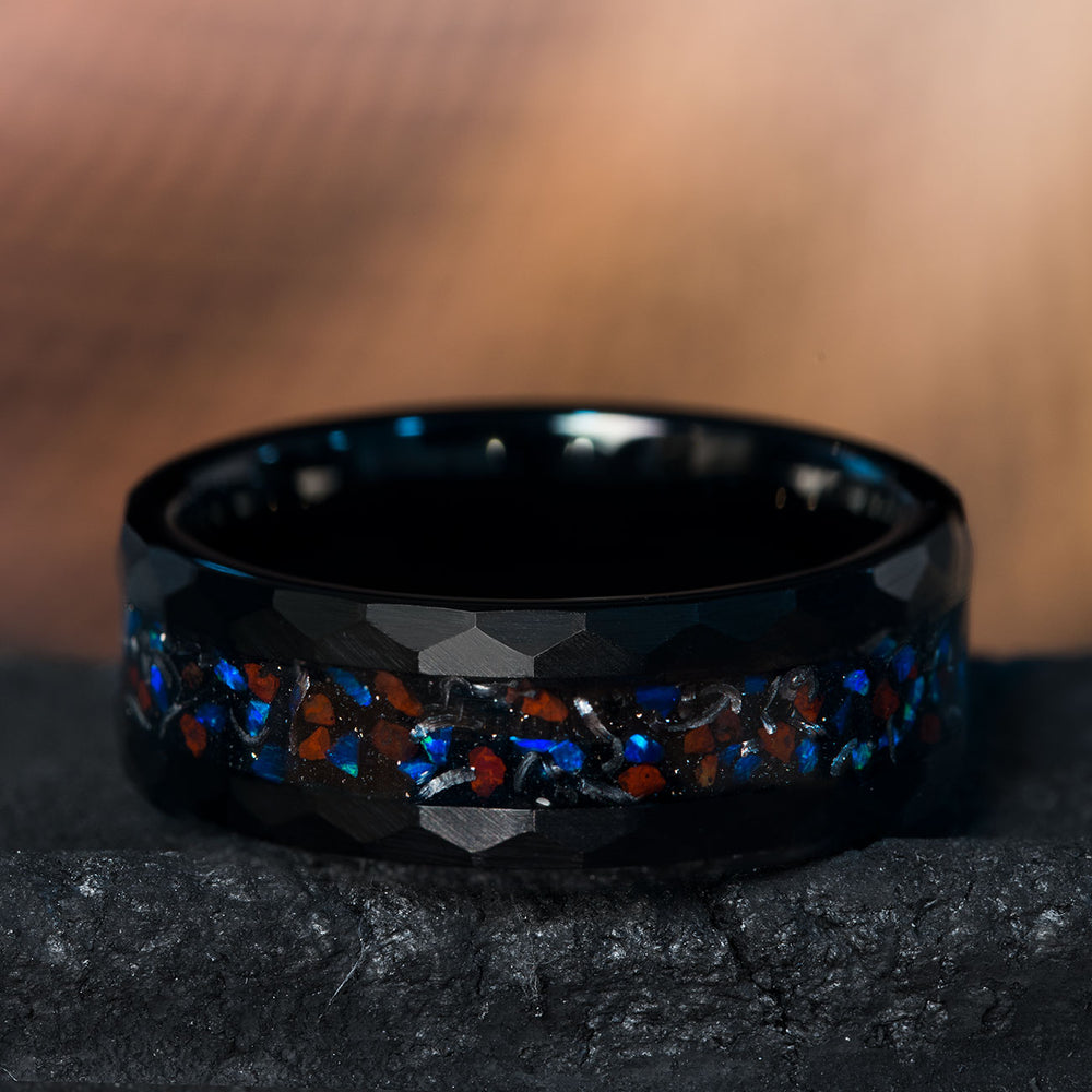 Men's black hammered tungsten wedding band with T. Rex bone, opal, and meteorite inlay.