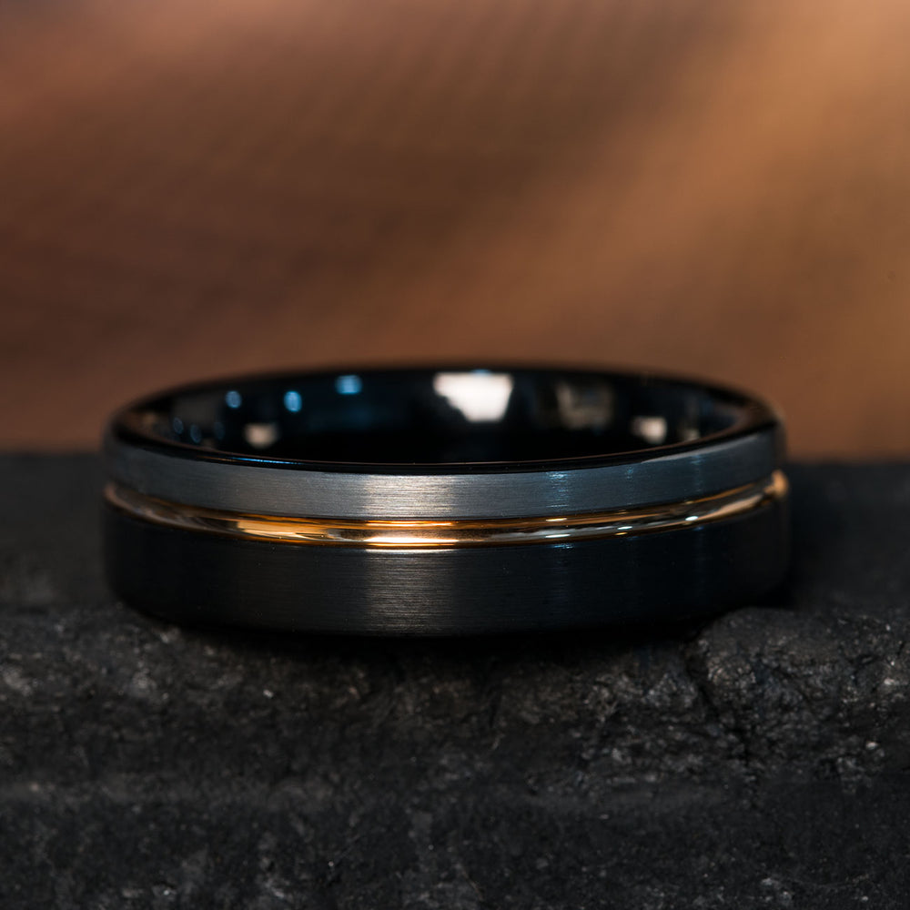 6mm brushed black tungsten ring with silver stripe and rose gold inner band, PVD coated.
