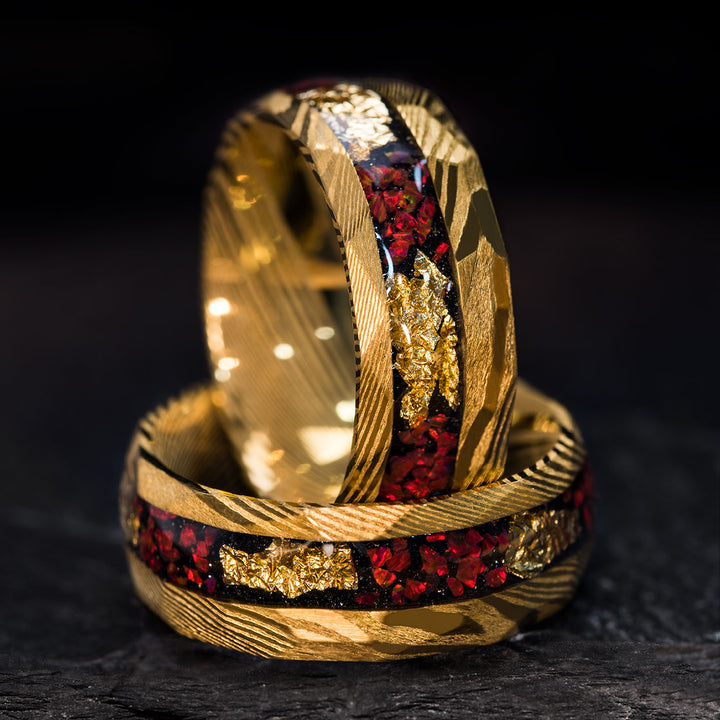 Golden Damascus steel ring with fire opal and gold leaf inlay