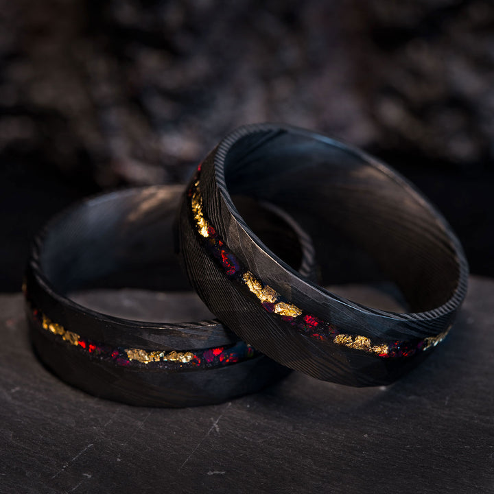 Close-up of THE BRAVE FIRE ring, Damascus steel, gold leaf, fire opal