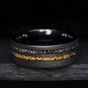 THE GOLDEN METEOR wedding ring: black sandblasted tungsten carbide with meteorite and gold foil inlay.
