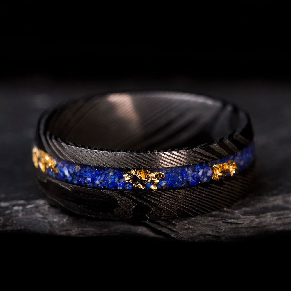 Black Damascus steel ring with lapis lazuli inlay and 22k gold leaf for men.