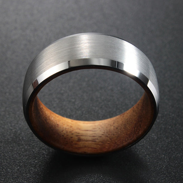The Terra tungsten band, silver brushed finish, beveled polished edge, natural wood interior.