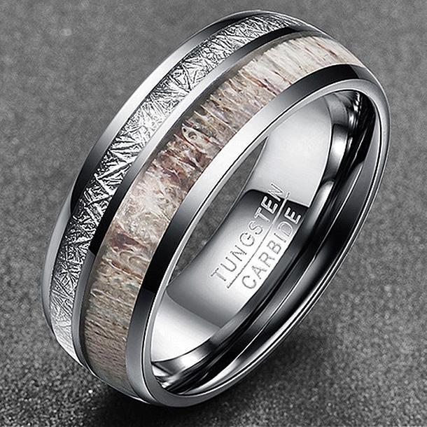 The Ibex tungsten carbide ring showcases unique antler and meteorite inlay, highlighting its natural beauty.