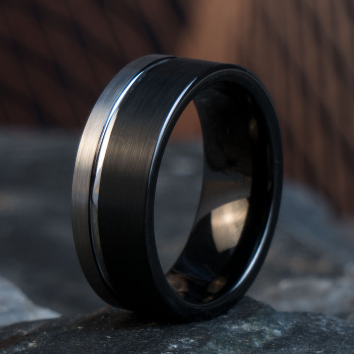 Tungsten ring with black brushed finish and silver stripe