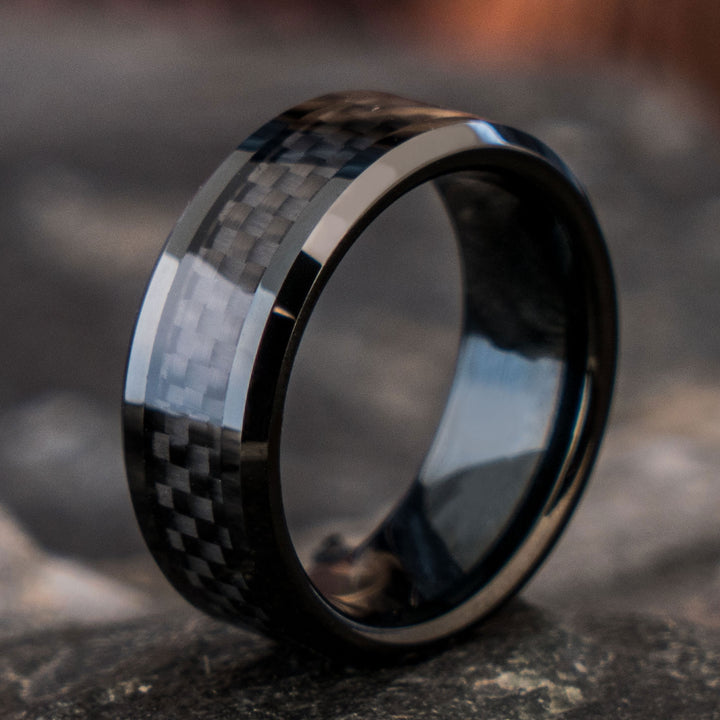 Black tungsten ring with forged carbon fiber inlay