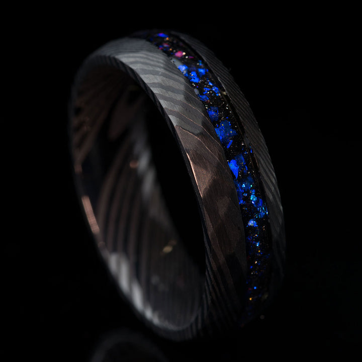 Black Damascus steel ring with blue Alexandrite inlay
