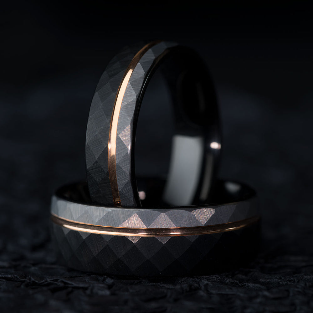 Hammered black and silver tungsten carbide wedding band with rose gold accent stripe, 8mm wide.