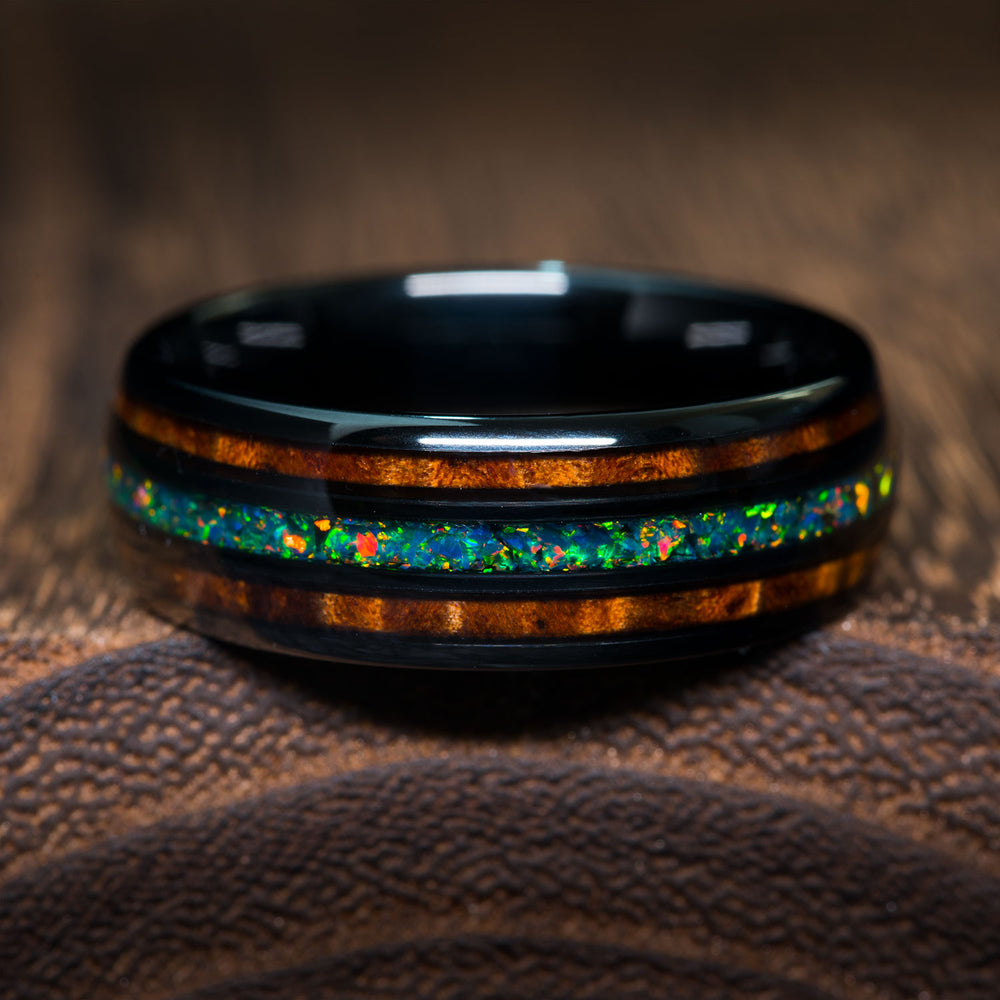 Black tungsten band with green opal and desert ironwood inlay for men's wedding rings.