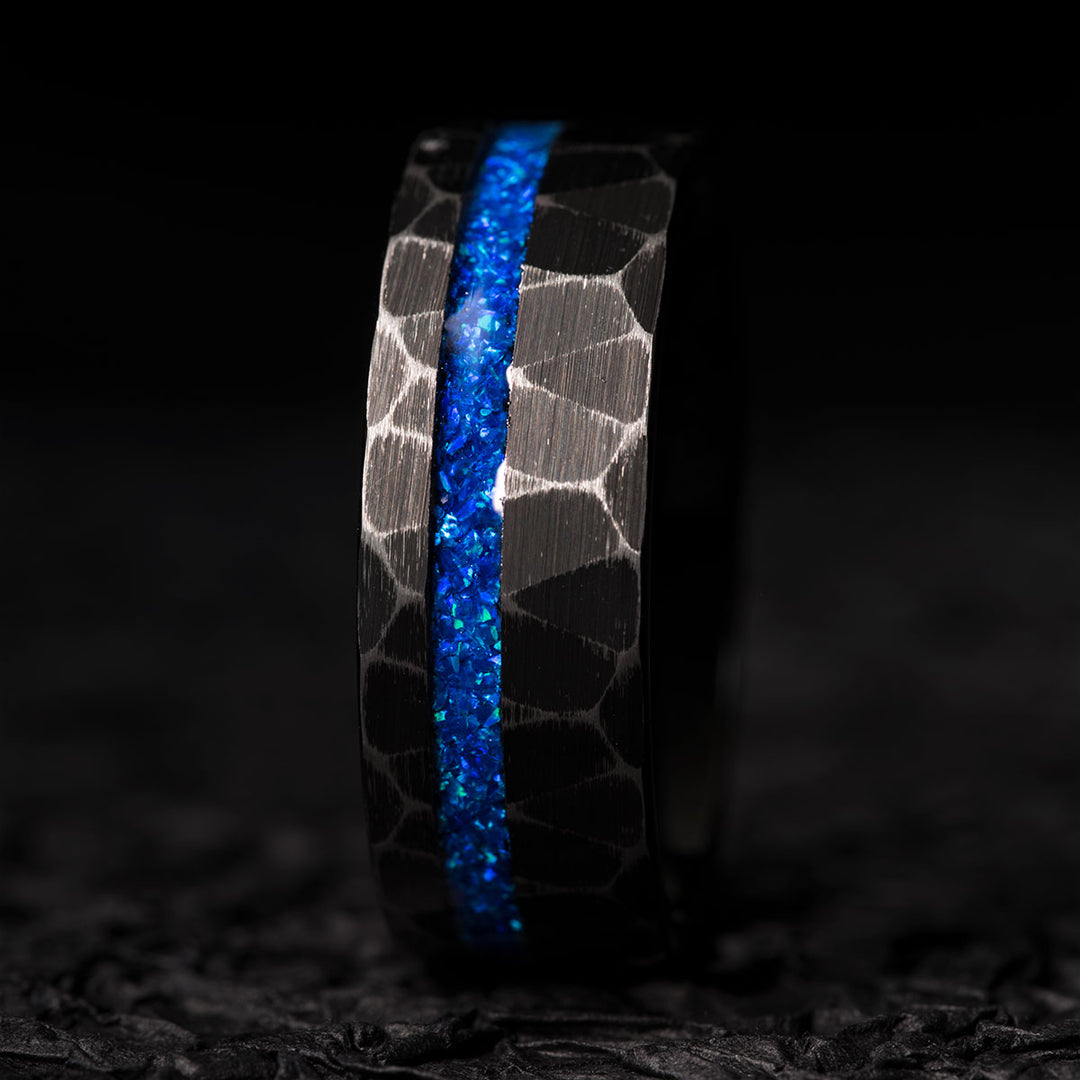 Black hammered tungsten ring with blue opal center inlay