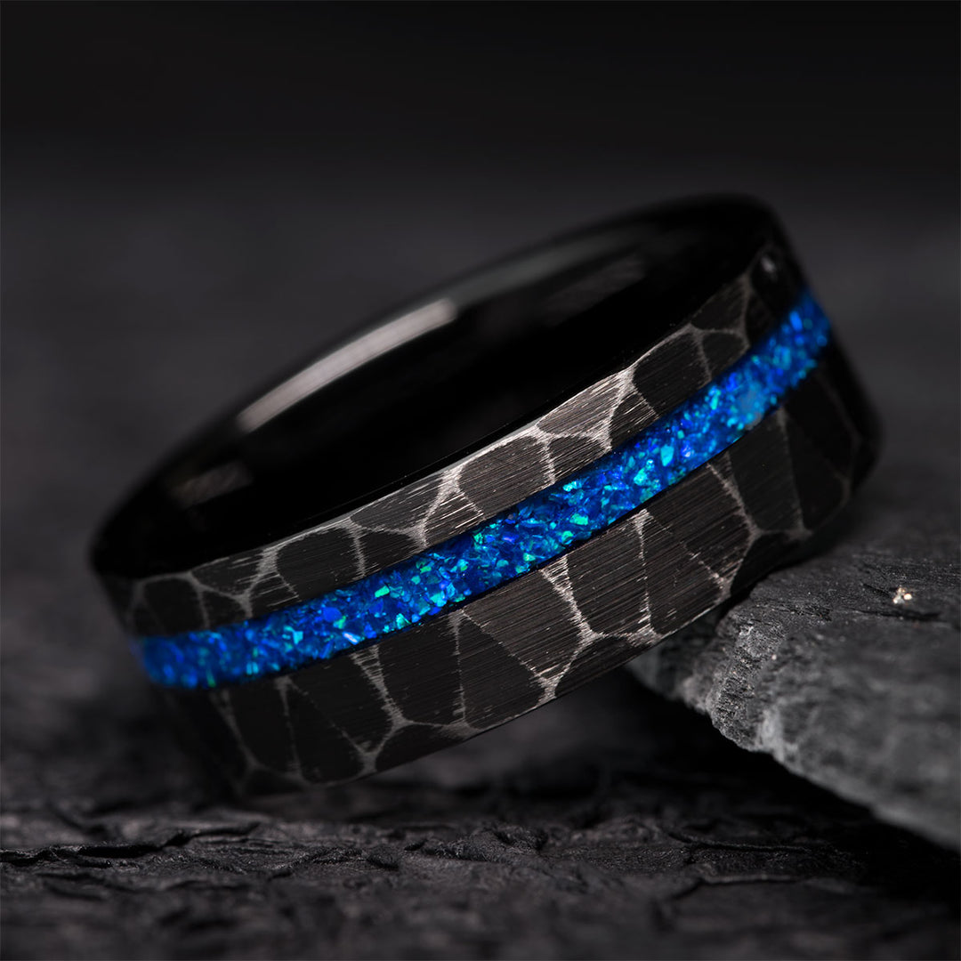 Black hammered tungsten ring with blue opal inlay