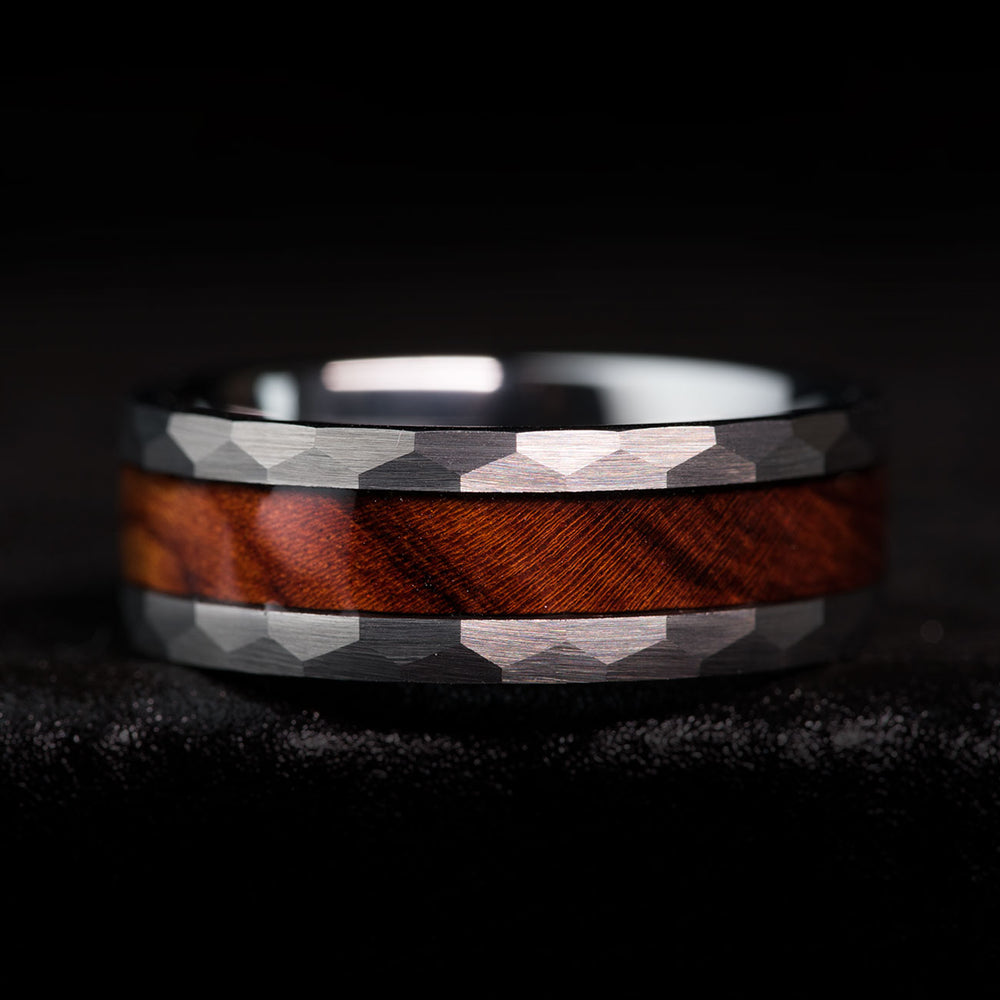 The Cowboy ring: hammered tungsten carbide band with desert ironwood inlay, showing materials and rustic design.
