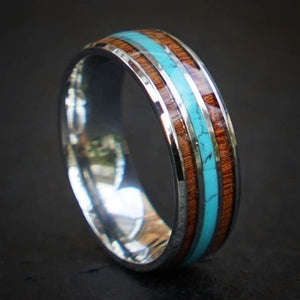 Silver titanium wedding band with redwood and turquoise inlay, showcasing natural textures and colors.