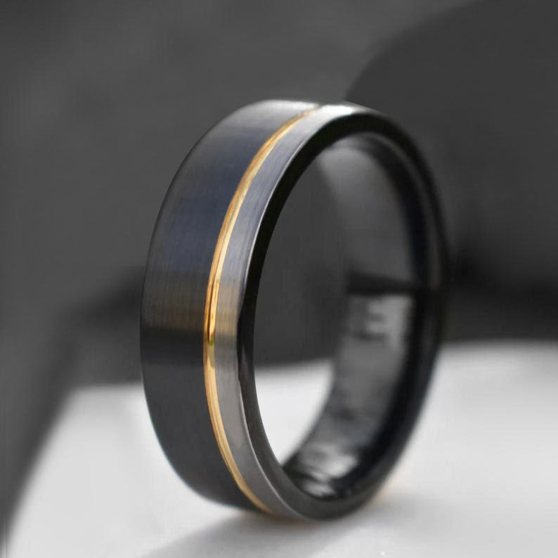 Black tungsten ring with gold stripe and silver trim - The Journeyman