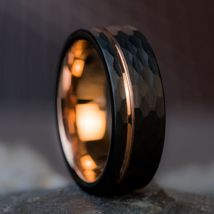 Black hammered tungsten ring with rose gold inlay