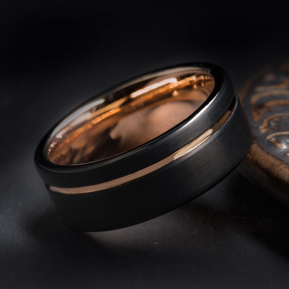 The Gentleman 8mm black brushed tungsten carbide band with polished rose gold inlay, ideal for wedding or engagement.