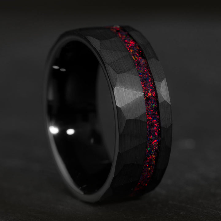 Black tungsten wedding ring with red starry sky opal inlay