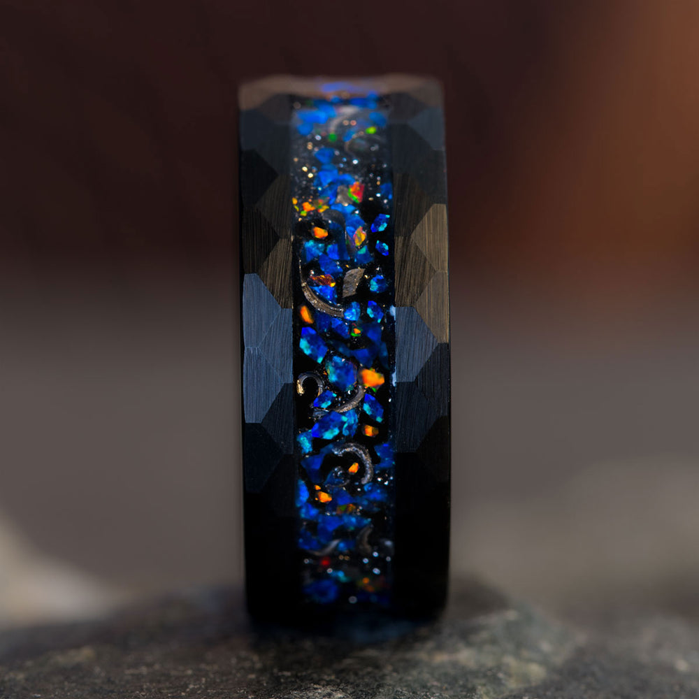 Black tungsten hammered ring with multicolor opal and meteorite inlay, evoking a starry night sky, product appearance.