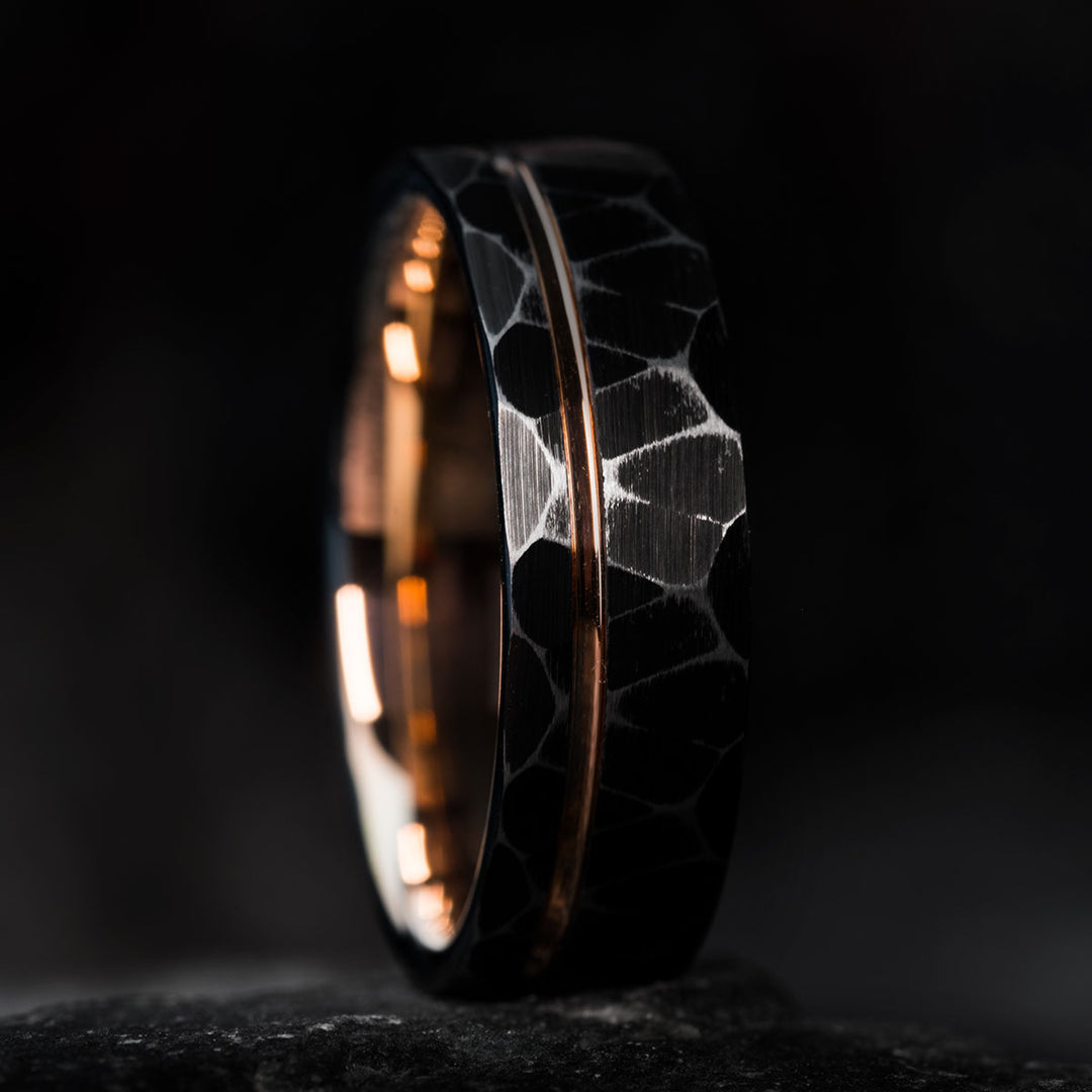 Rustic black tungsten wedding ring with rose gold inlay