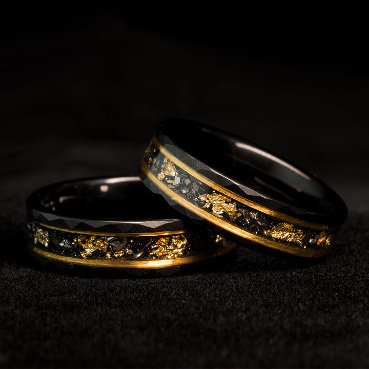Black meteorite rings with gold leaf detail, unique wedding bands