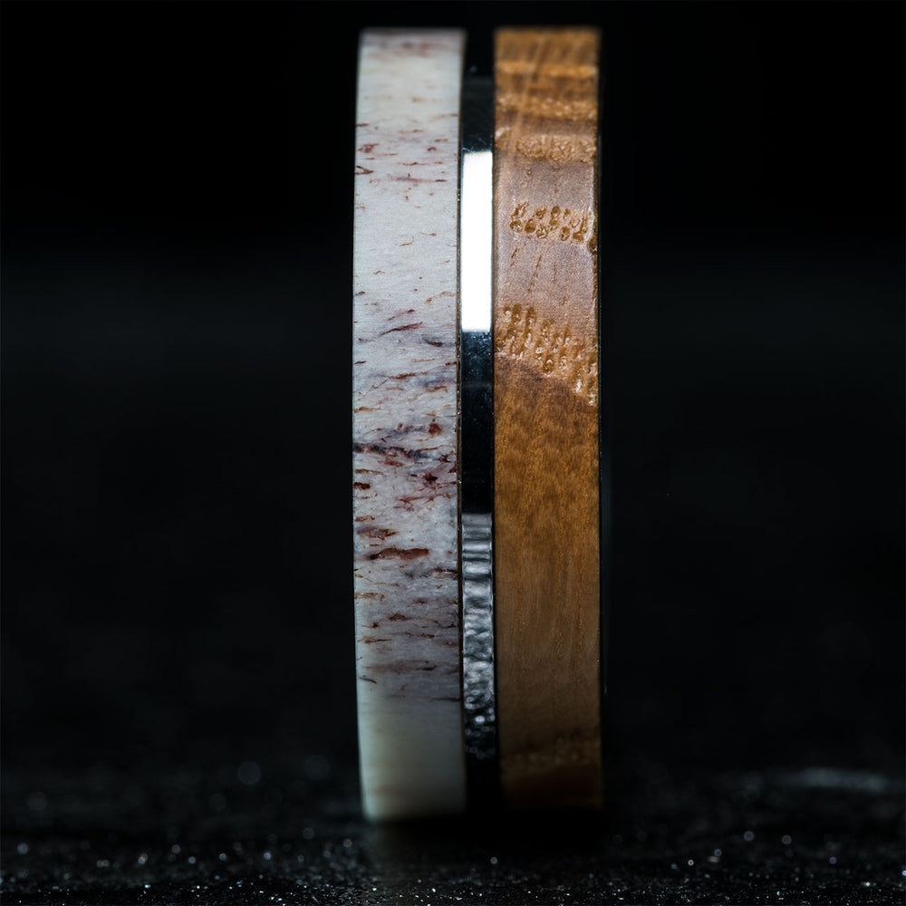8mm wide antler and whiskey barrel wedding ring with titanium pinstripe.