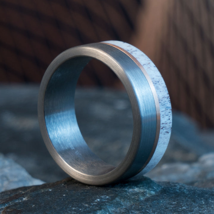 Antler and tungsten wedding ring with rose gold accent