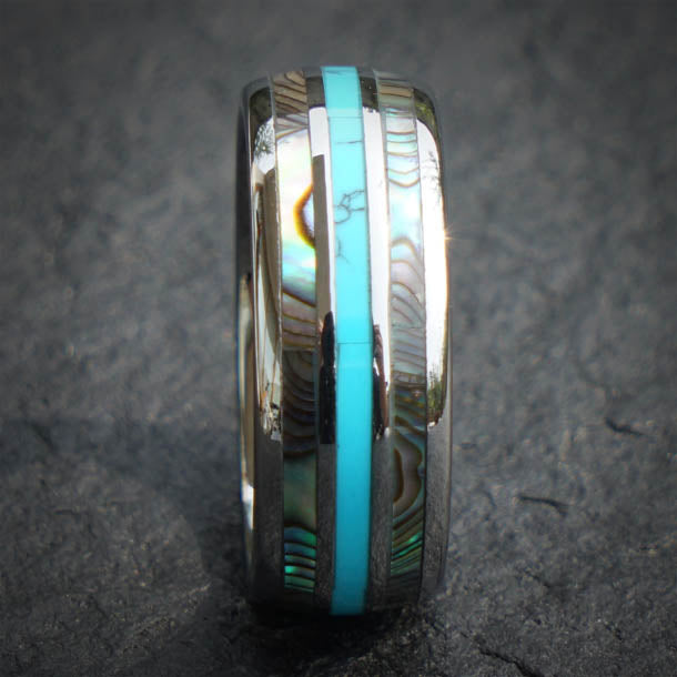 Close-up of The Wizard ring: tungsten band with turquoise inlay