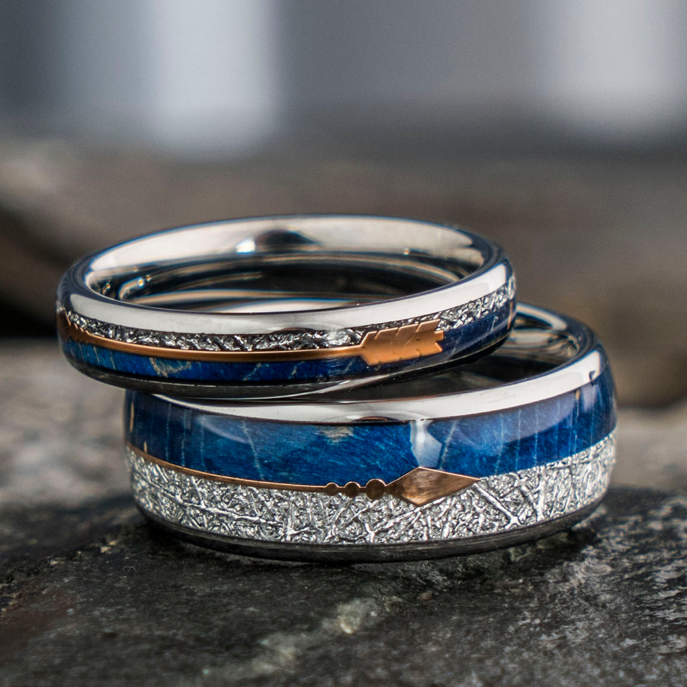 The Cupid tungsten wedding bands, 8mm & 4mm, with blue elder wood, meteorite, and rose gold arrow design.