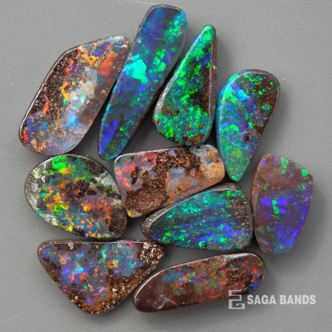 Assortment of vibrant blue opal gemstones, Saga Bands