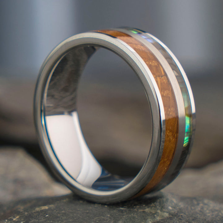 Close-up of THE MERCURY ring with whiskey barrel inlay and abalone shell